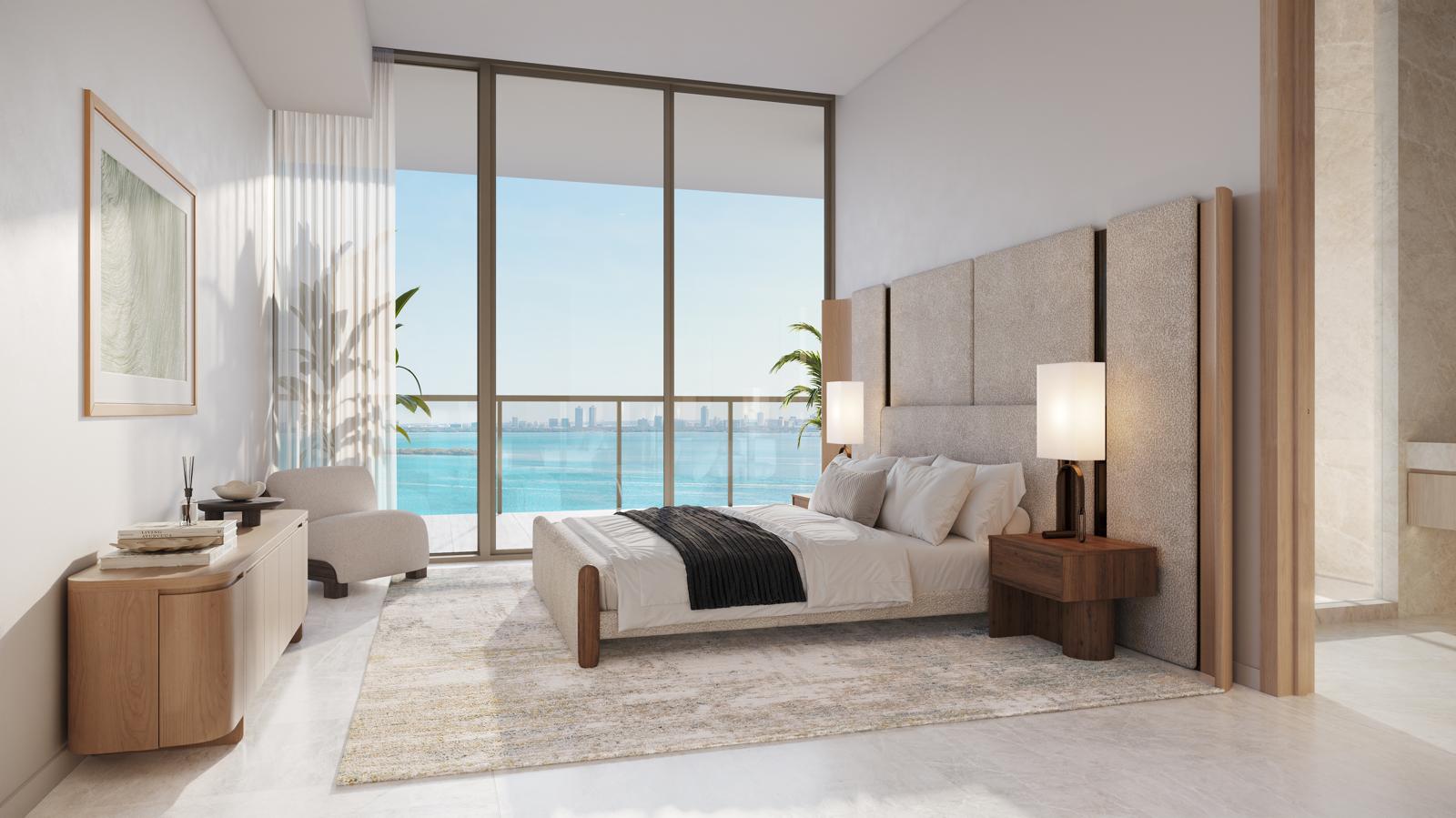 Primary bedroom with floor-to-ceiling windows and bay views